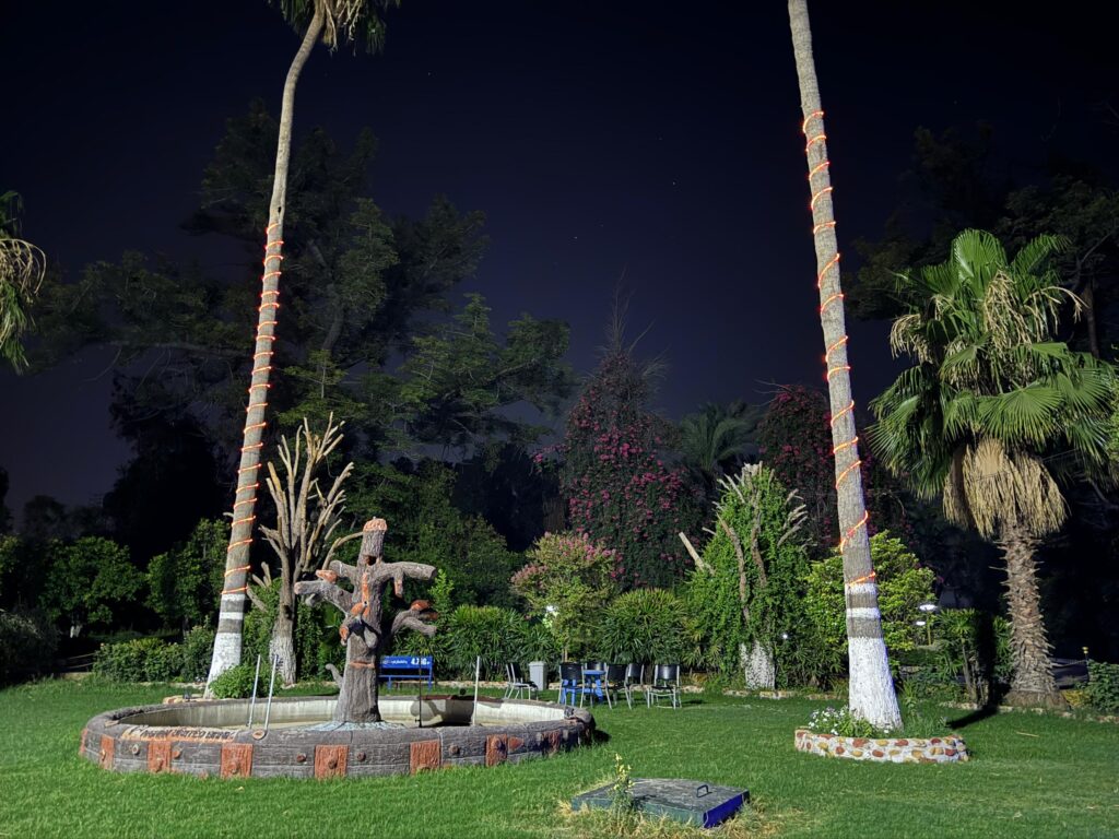 Spin Ghar Hotel garden at night